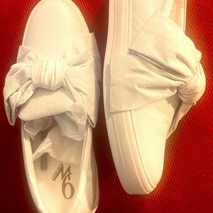 Women’s 9 West slip on sneaker. Size 9. Runs large. All white leather